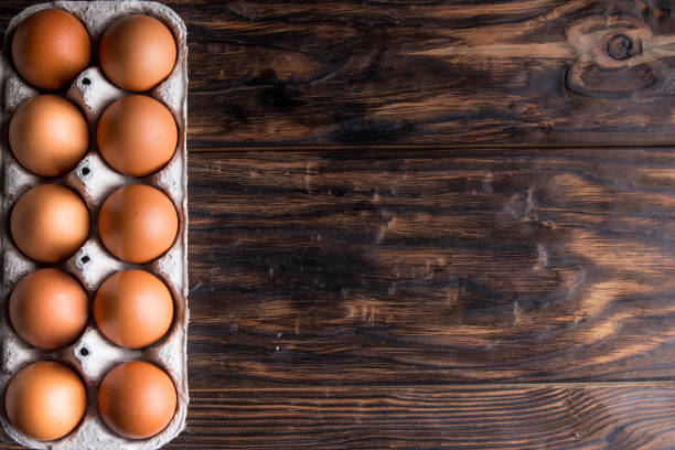 istock chicken eggs on old wooden board with blank space for text 1124830095