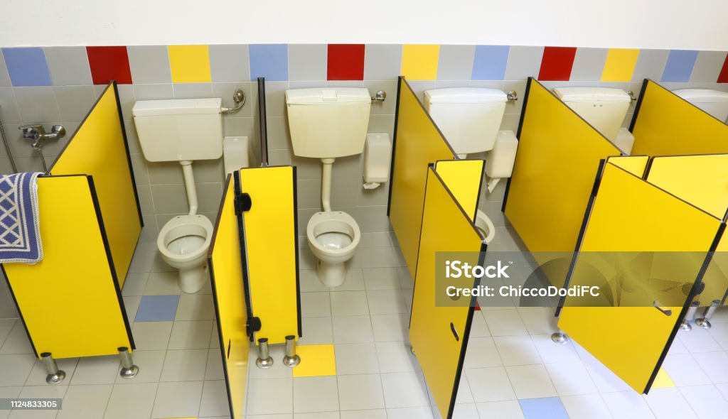 small toilet with yellow doors small toilet with yellow doors in the kindergarten Community Stock Photo