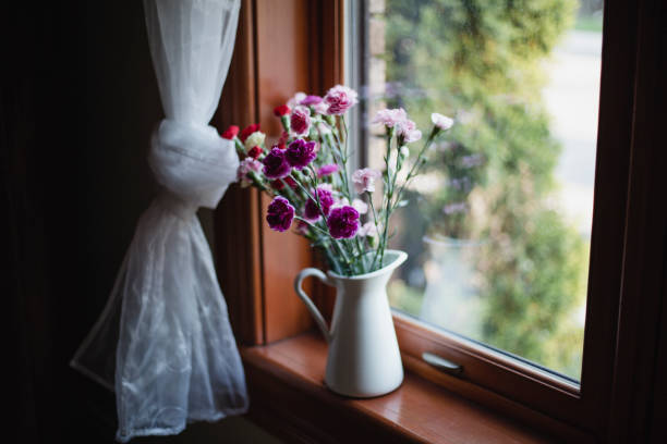 bluebells in vase on windowsill