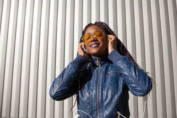 istock Beautiful and young afro woman with braids 1124839666