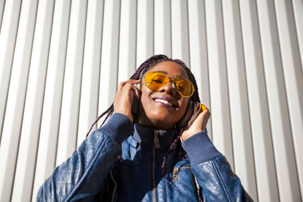 istock Beautiful and young afro woman with braids 1124839668