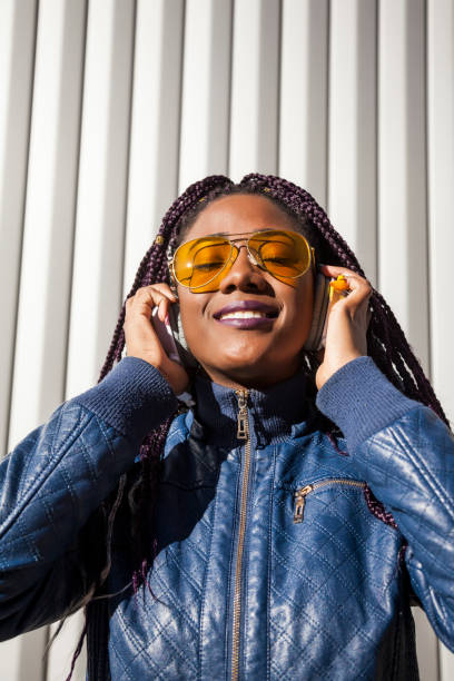 istock Beautiful and young afro woman with braids 1124839671