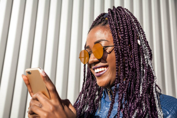 istock Beautiful and young afro woman with braids 1124839688