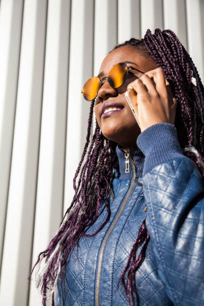 istock Beautiful and young afro woman with braids 1124839689