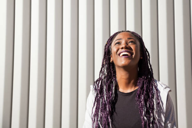 istock Beautiful and young afro woman with braids 1124839704