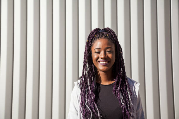 istock Beautiful and young afro woman with braids 1124839705
