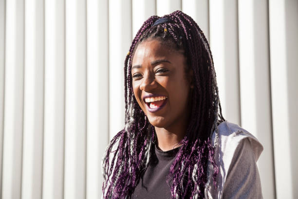 istock Beautiful and young afro woman with braids 1124839708