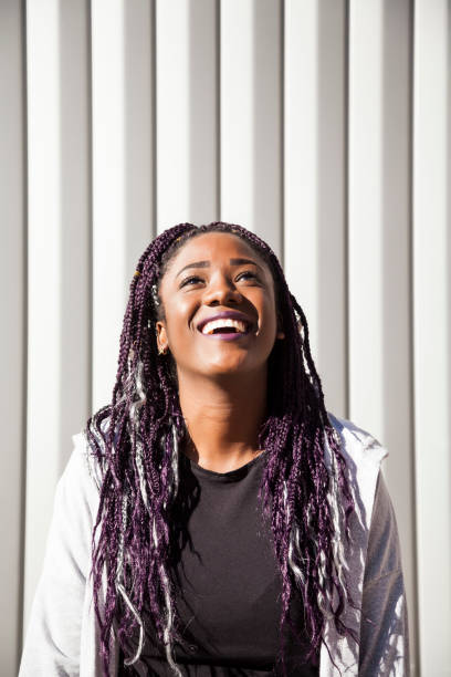istock Beautiful and young afro woman with braids 1124839711
