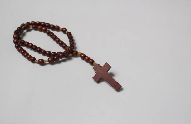 istock Catholic wooden rosary on white background 1124842462