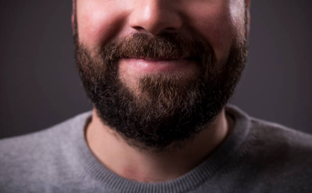 istock Closeup of a man beard and mustache over gray background 1124847337