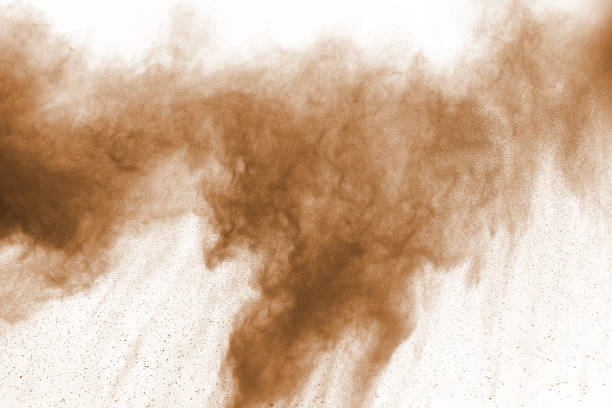 istock Brown color powder explosion on white background. Colored cloud. Colorful dust explode. Paint Holi. 1124852852