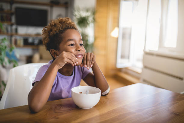istock Funny playful child enjoying breakfast and having fun 1124853517