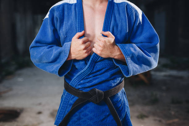 istock Good looking judoka holding on to his gi kimono 1124855559