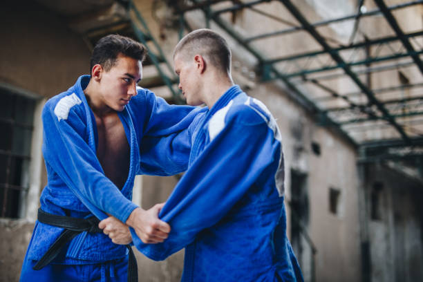 Strong and healthy judo practitioners fighting