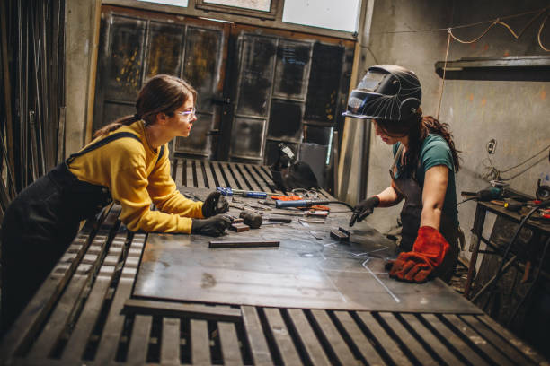 istock Siblings working together in a metal shop 1124860055