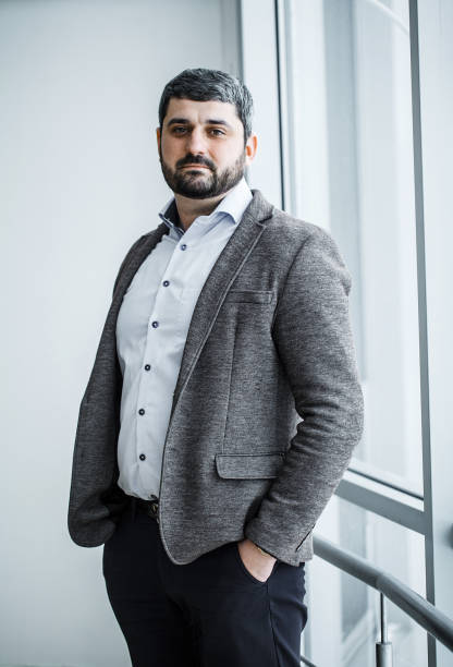 istock Happy mature business man looking at camera with satisfaction at office 1124870747