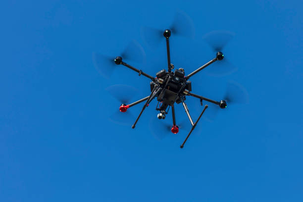 istock Drone flying and working for ortophoto and thermal analysis of PV Plants with visual and thermal camera. UAV are used for easy aerial inspections of Solar, Wind and Hydro renewable energy resources 1124873281