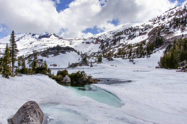 Views of frozen Fontanillis Lake and Dicks Peak in late Spring Desolation Wilderness, El Dorado County, California, USA. pacific crest trail stock pictures, royalty-free photos & images