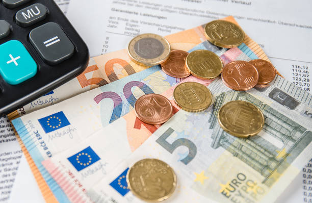 istock cash on a bill with calculator in the background 1124919227