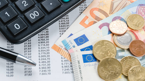 istock cash on a bill with calculator in the background 1124919622