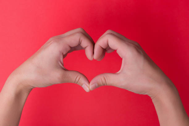istock Female heart shape hand 1124921217