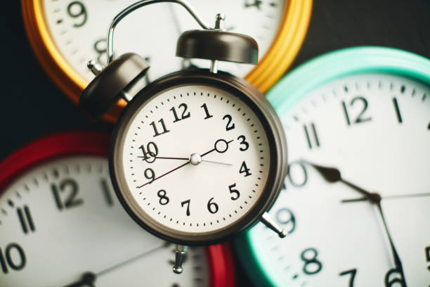 istock Collection of vibrant colored wall clocks with alarm clock 1124921463