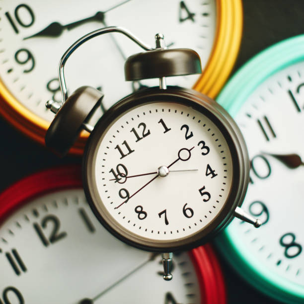 istock Collection of vibrant colored wall clocks with alarm clock 1124921465