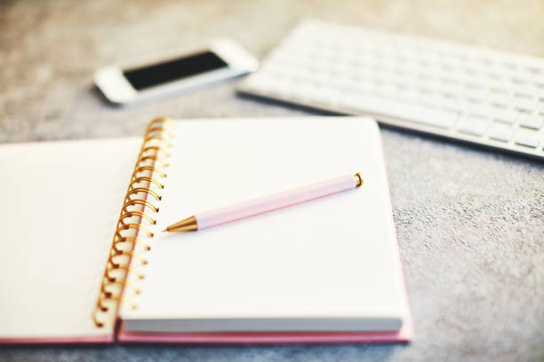 istock Bloggers desk with phone, keyboard and accessories 1124923754