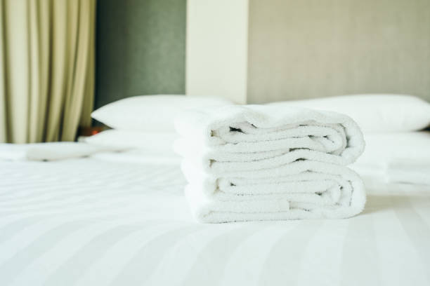 istock White towel on bed decoration interior 1124926172