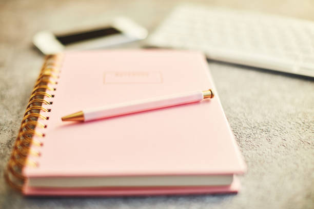 istock Bloggers desk with phone, keyboard and accessories 1124928666