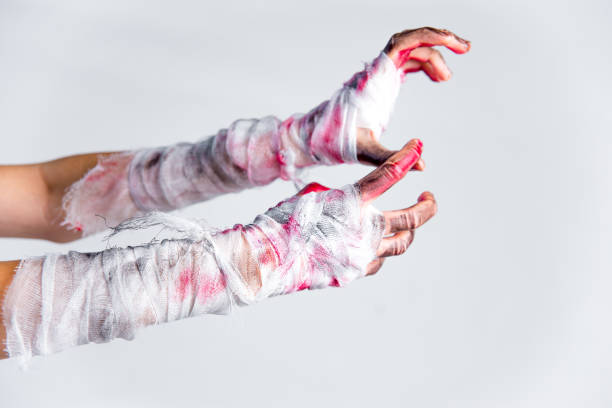 istock Halloween theme: an image of zombie hands with black nails 1124930498