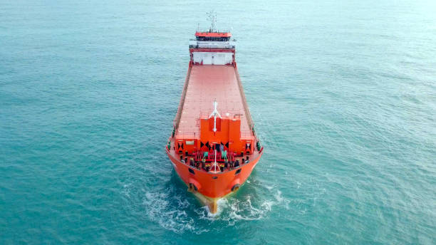 istock Large Red general Cargo ship anchored at sea 1124933754