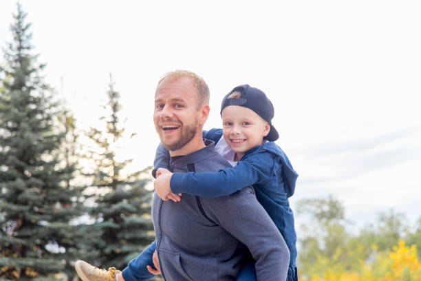 istock Father and son are spending time in a park 1124938886