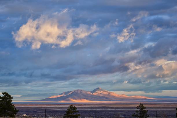istock Antelope Island view from Magna, sweeping cloudscape at sunrise with the Great Salt Lake State Park in winter. USA, Utah. 1124940247
