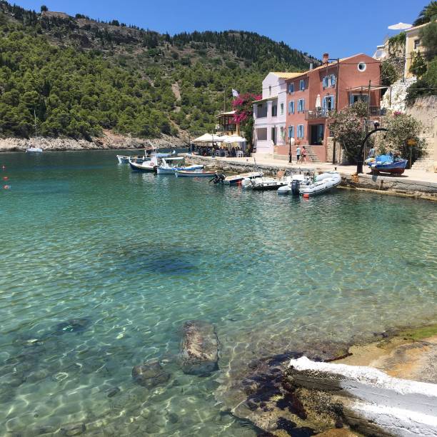 istock Clear blue sea and boats at Assos 1124940673