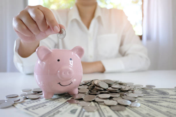 istock Female hand stack coins  growing business. Saving money. 1124942916