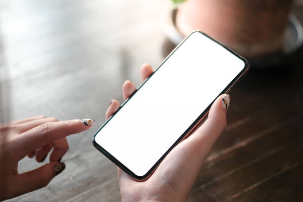 istock Women's hands holding cell telephone blank copy space screen. smart phone with technology concept. 1124942996