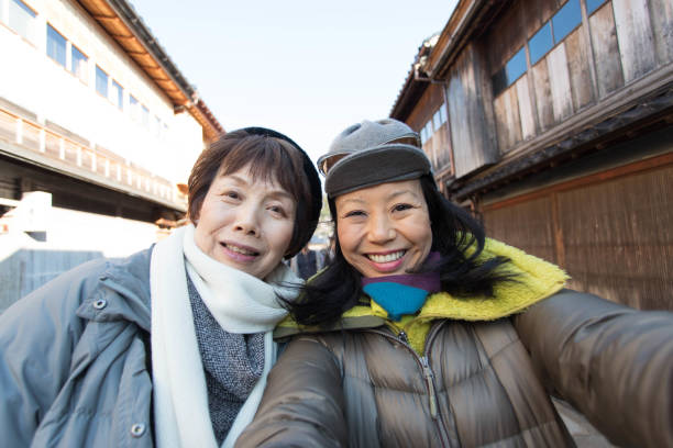 istock Mother and daughter enjoying snow 1124944319