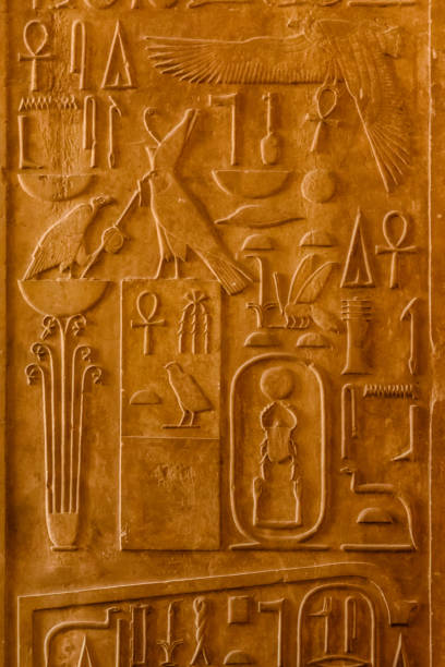 istock Egyptian ancient hieroglyphs on the stone wall 1124944398