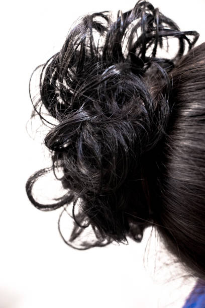 istock hairstyle bun on the brunette on isolated light background 1124944412