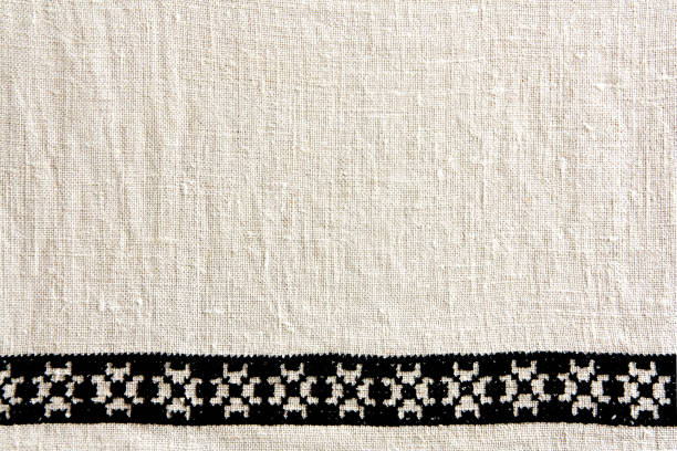 textura de linho natural bege antiga para o plano de fundo (foco manual) - embroidery canvas beige close up - fotografias e filmes do acervo
