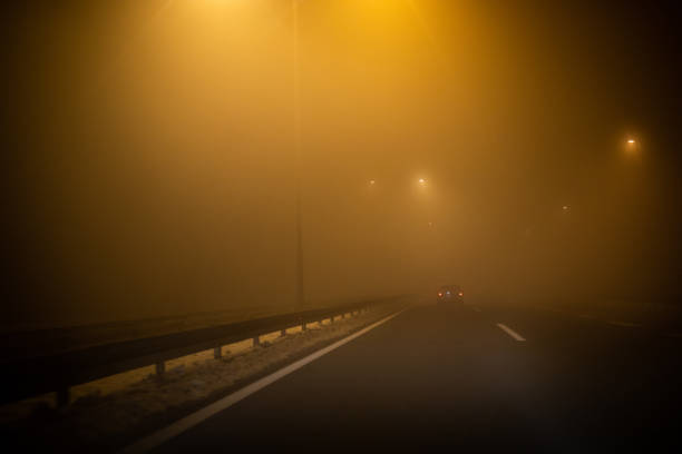 istock Driving at night through fog 1124951872