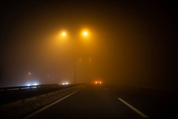 istock Driving at night through fog 1124952362