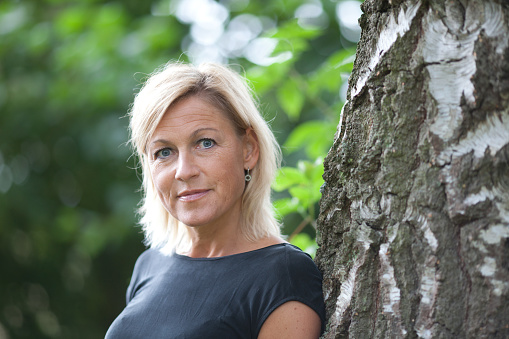 Portrait of a cute blond scandinavian woman shot outdoor
