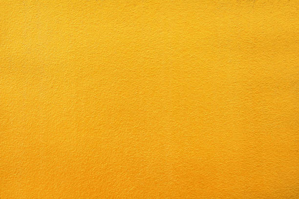 istock Colorful bright gold paint concrete wall patterns texture abstract for background 1124955780