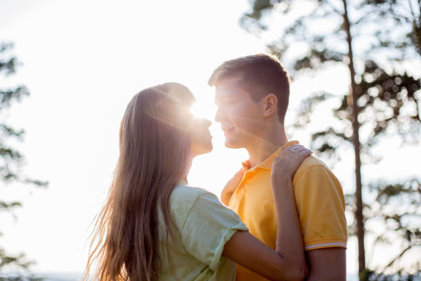 istock young couple in love walking in the forest together 1124955821