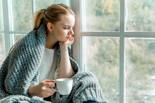 istock Sick young woman with cold and flu at home 1124957870