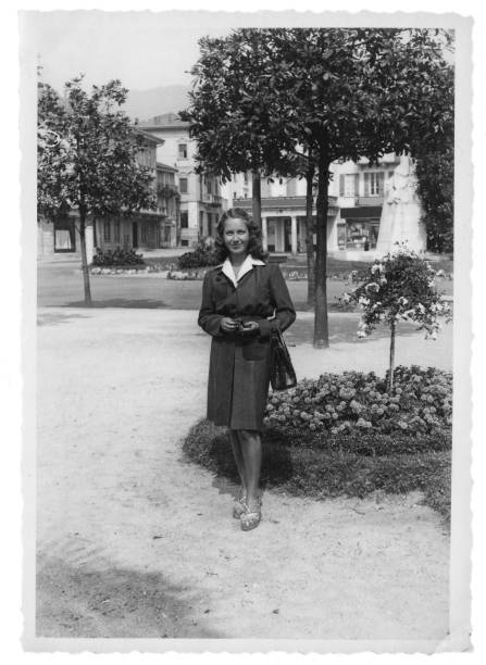 istock Young Woman in Public Park, 1941 1124958504