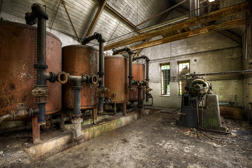 Urbex (urban exploration): rusty heating boilers in an abandoned factory (HDR)