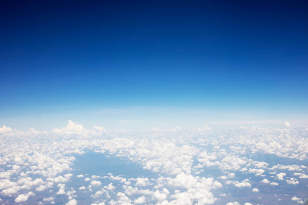 istock Blue sky background and white clouds soft focus, top view and copy space 1124960829